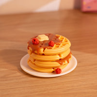 Decorative waffle trinket dish shown as a small resin jewelry box