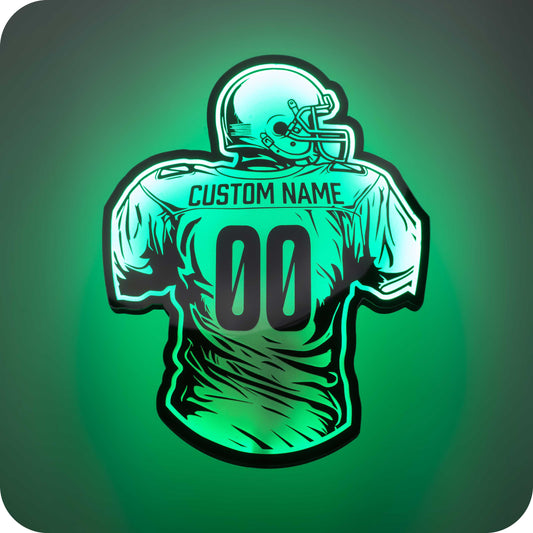 a 3d wall mounted acrylic light, back-lit by  multi-color led lights, featuring a cartoon style illustration of an American football player, view from behind showing the back of the players jersey. The text and number on the back of the jersey can be personalised.