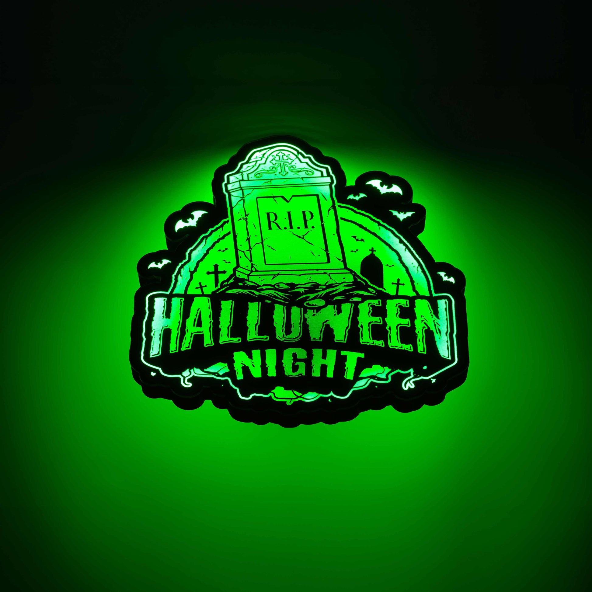 a 3d wall mounted acrylic light, backlit by multi-color led lights, featuring a cartoon style scary halloween themed illustration. A scary tomb stone rises up from a haunted grave yard scene complete with bats and spooky halloween themed text that reads "halloween night".
